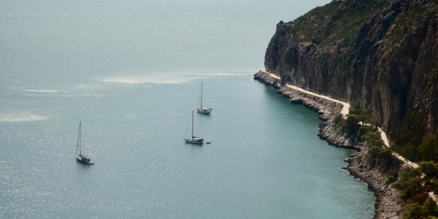 Coastal view of Nafplio in the Peloponnese, Greece, with old town buildings above the sea