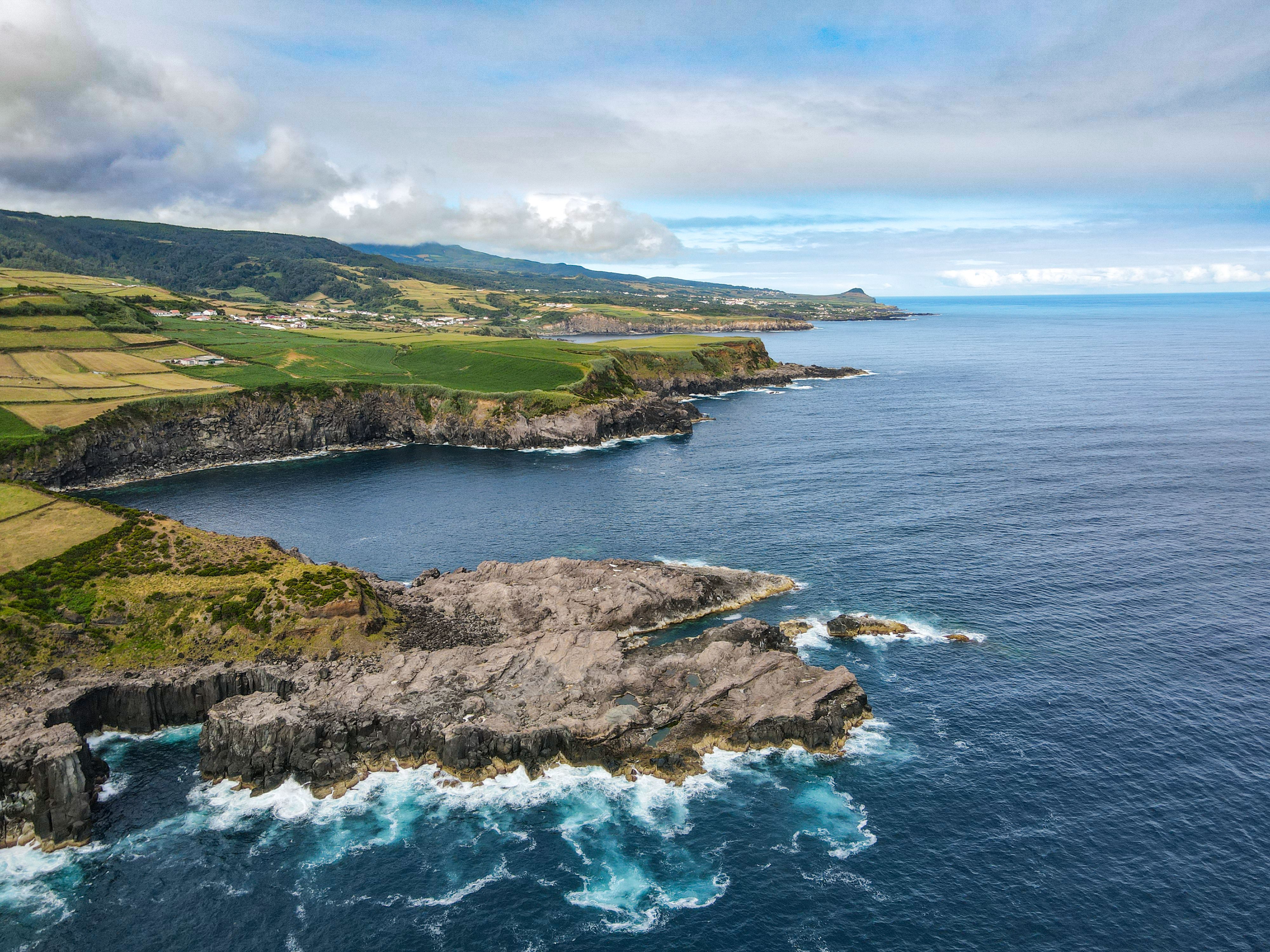 Green sea cliffs of São Miguel dropping into the Atlantic ocean in the Azores