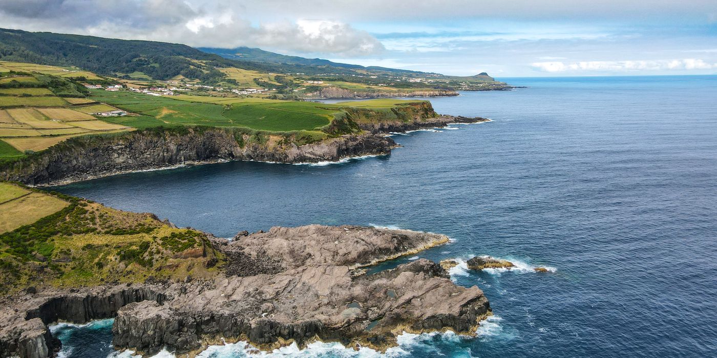 Green sea cliffs of São Miguel dropping into the Atlantic ocean in the Azores