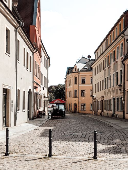 Free Cobblestone street with traditional buildings in Pirna, showcasing a classic European charm. Stock Photo