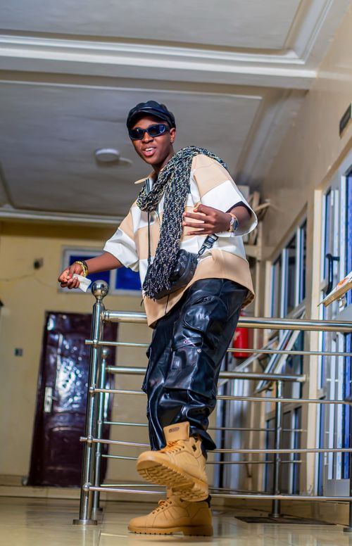 Free Young man in trendy outfit posing indoors, showcasing urban style. Stock Photo