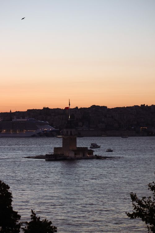Free Maiden's Tower at sunset with Istanbul skyline, offering a classic view. Stock Photo