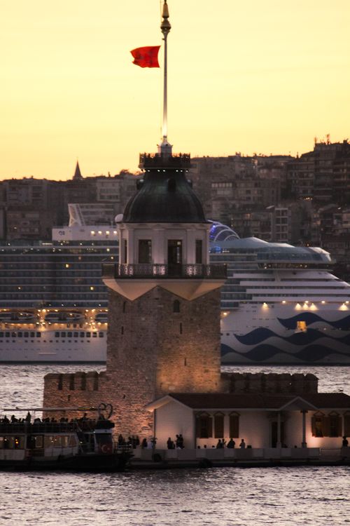 Free Stunning view of Istanbul's Maiden's Tower at sunset, showcasing its historical charm and vibrant skyline. Stock Photo