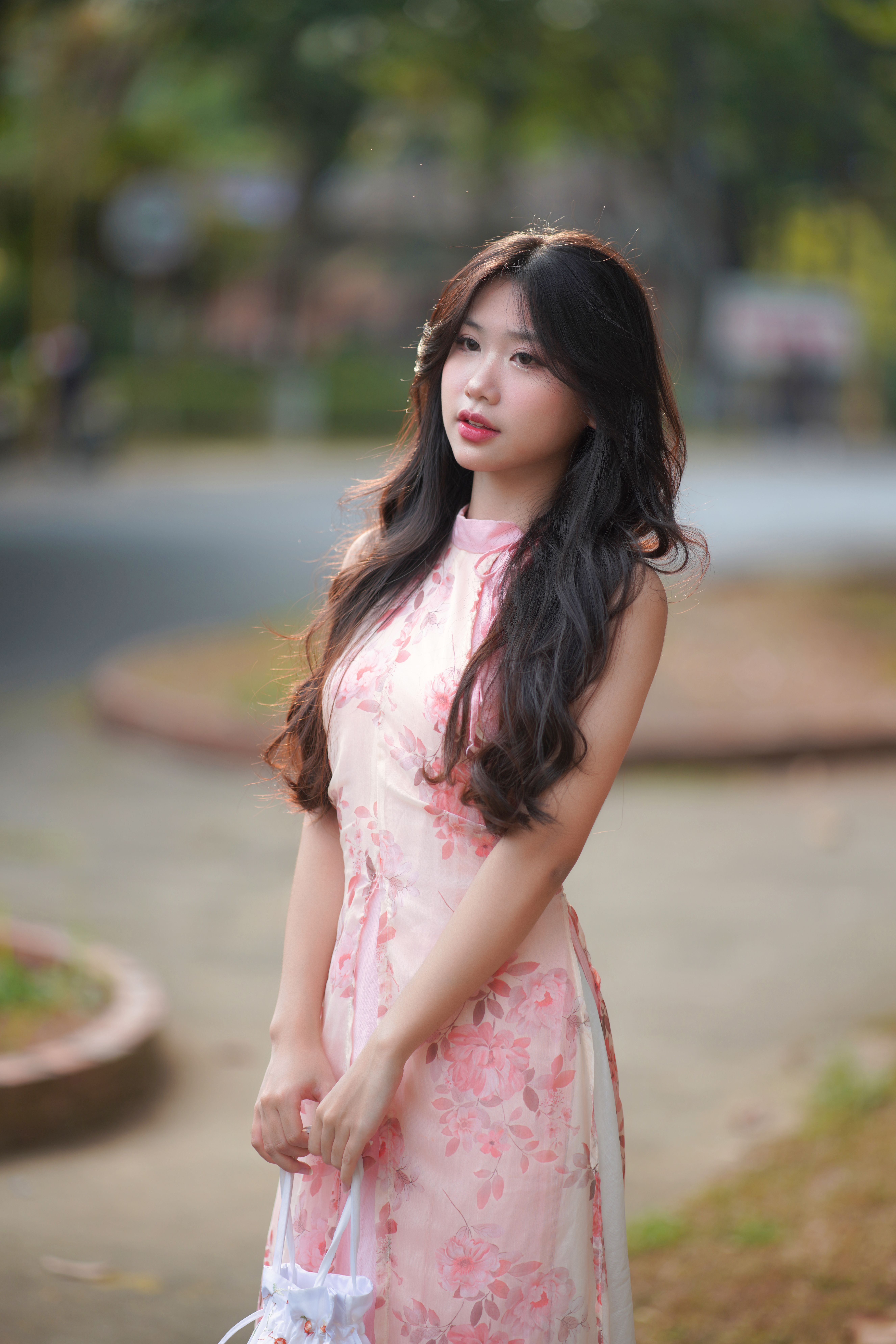 Portrait of Woman in Floral Dress Outdoors · Free Stock Photo