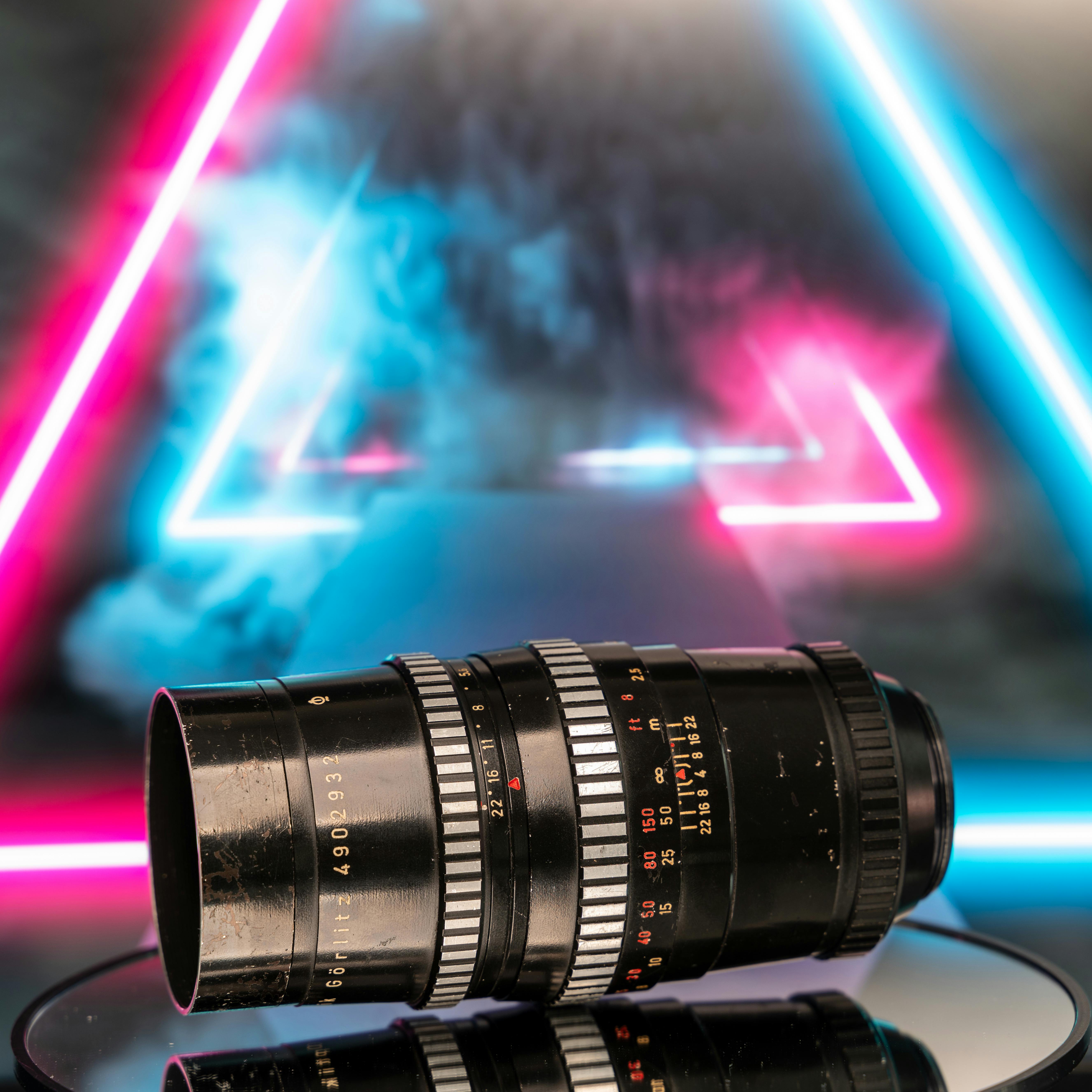 Vintage Camera Lens with Neon Triangle Background · Free Stock Photo
