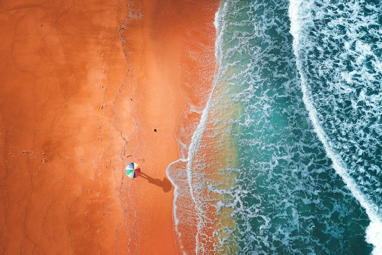 Aerial View Of Umbrella On Seashore