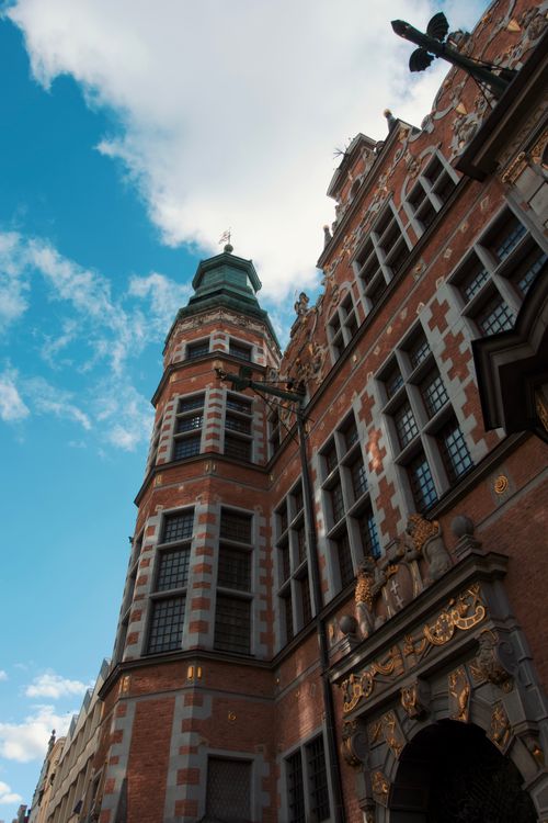 Free Stunning view of a historic building with intricate details against a vibrant blue sky. Stock Photo