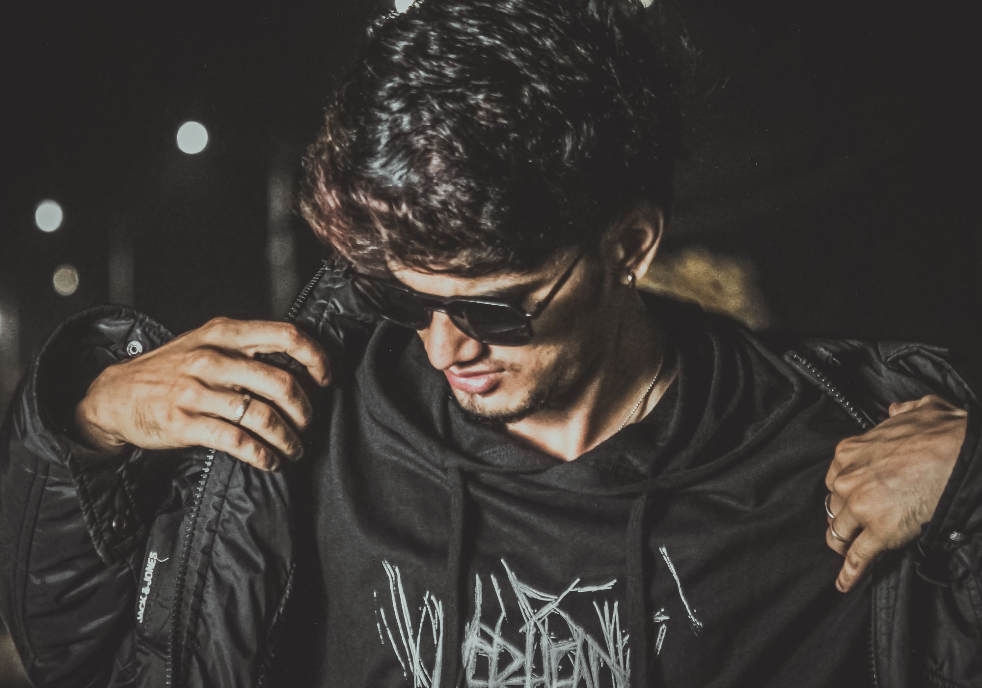 Gumbell After Dark campaign — models in dark tailored streetwear at night