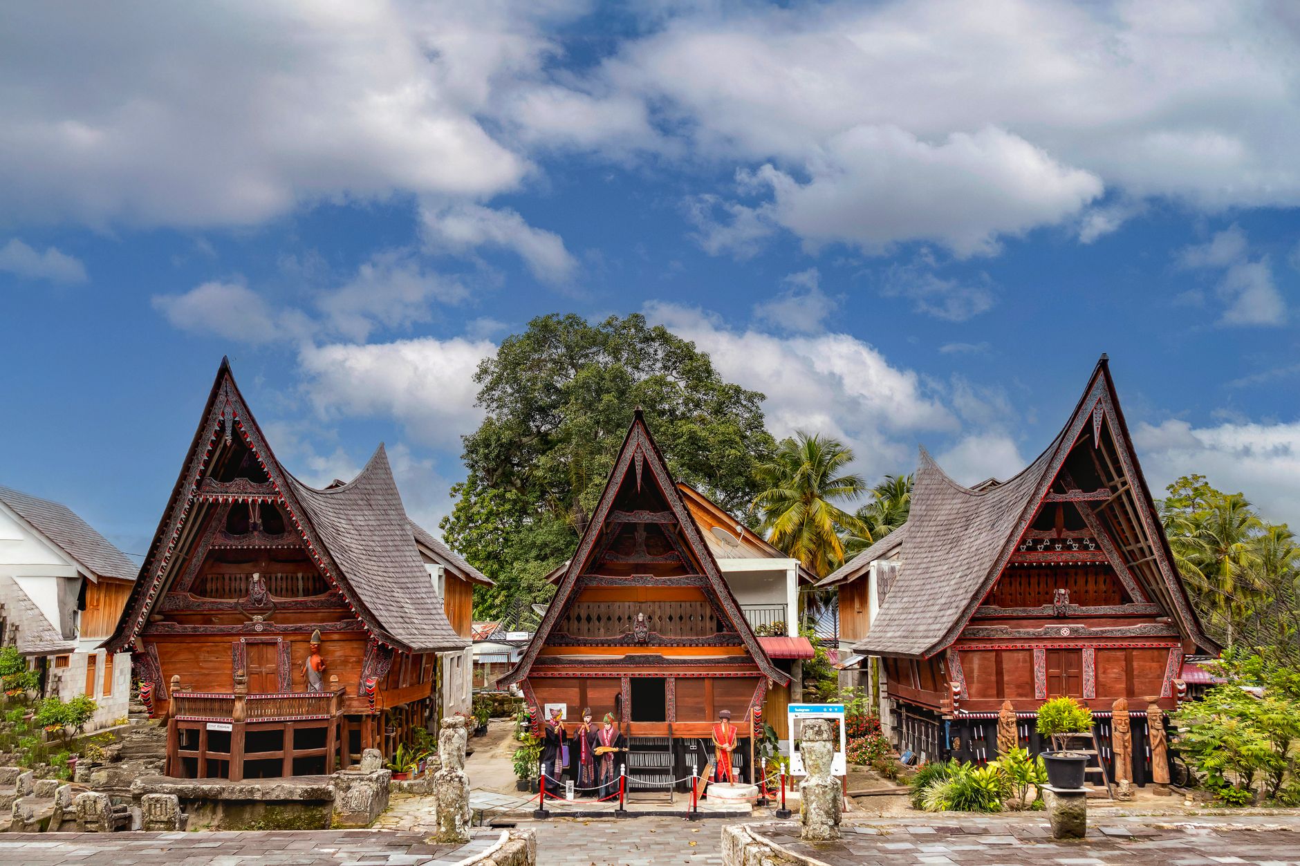 Stunning traditional Batak architecture under a vibrant sky in Indonesia.
