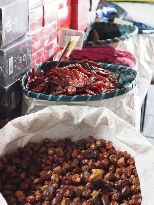Free Colorful spices in sacks at an outdoor market in Doha, Qatar, showcasing a variety of culinary ingredients. Stock Photo