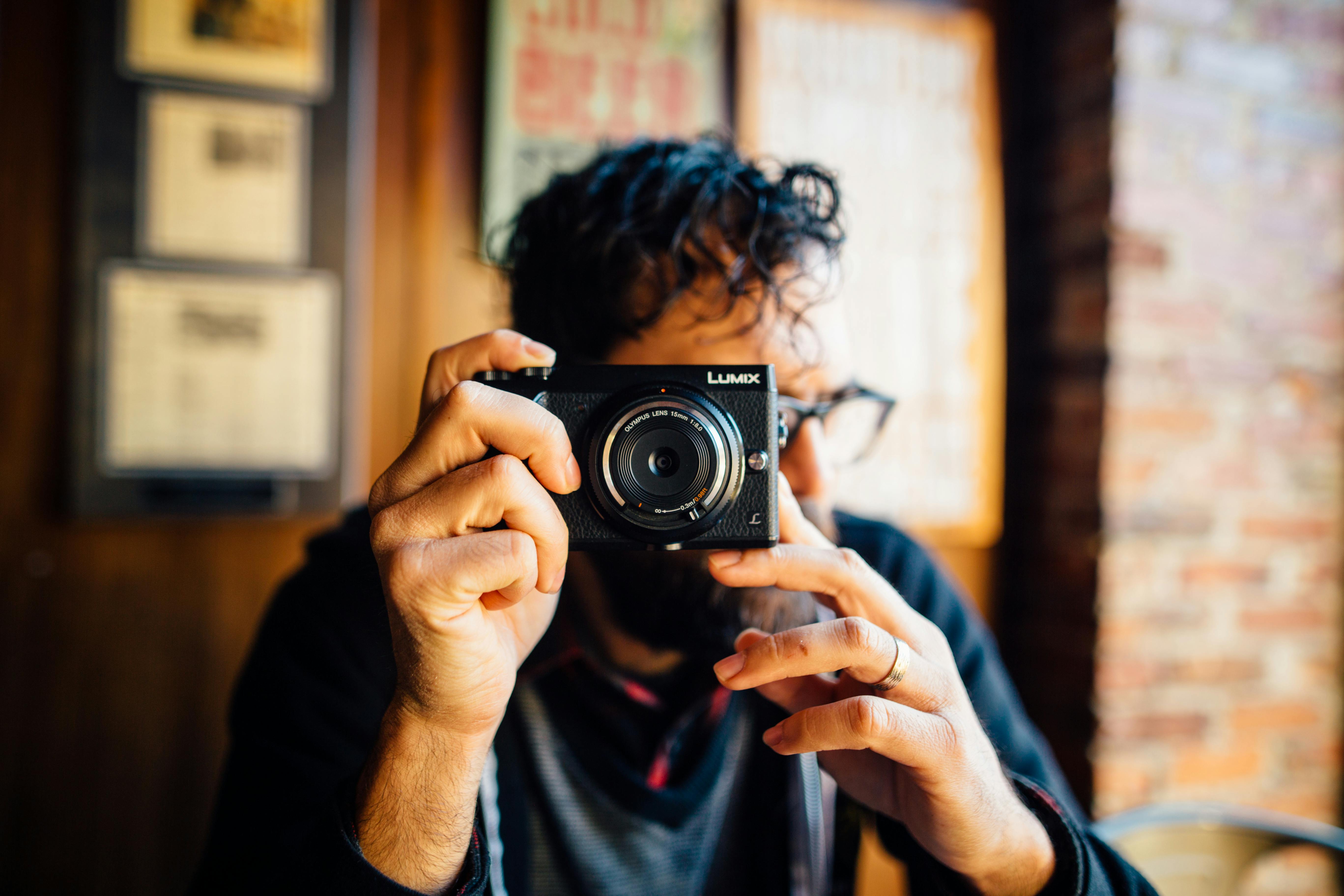 Man Holding A Camera · Free Stock Photo