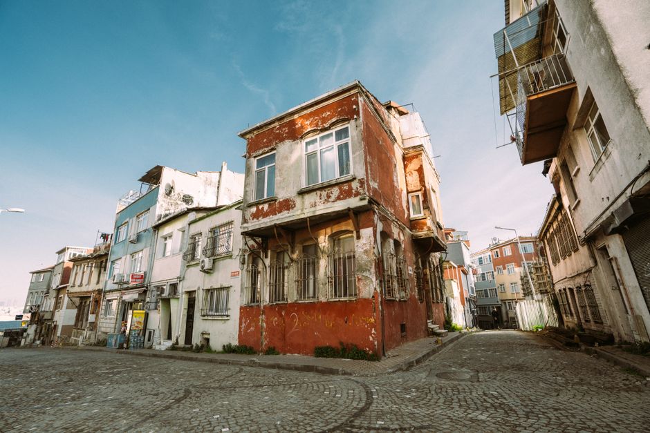 Aged buildings in a quiet street showcasing urban decay and architectural charm.