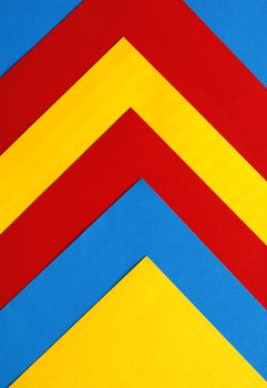 Vibrant chevron pattern with red, yellow, and blue colors, ideal for modern abstract design.