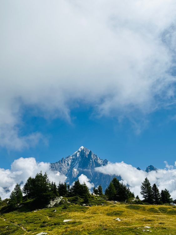 Majestic Mountain Peaks Under Blue Sky · Free Stock Photo