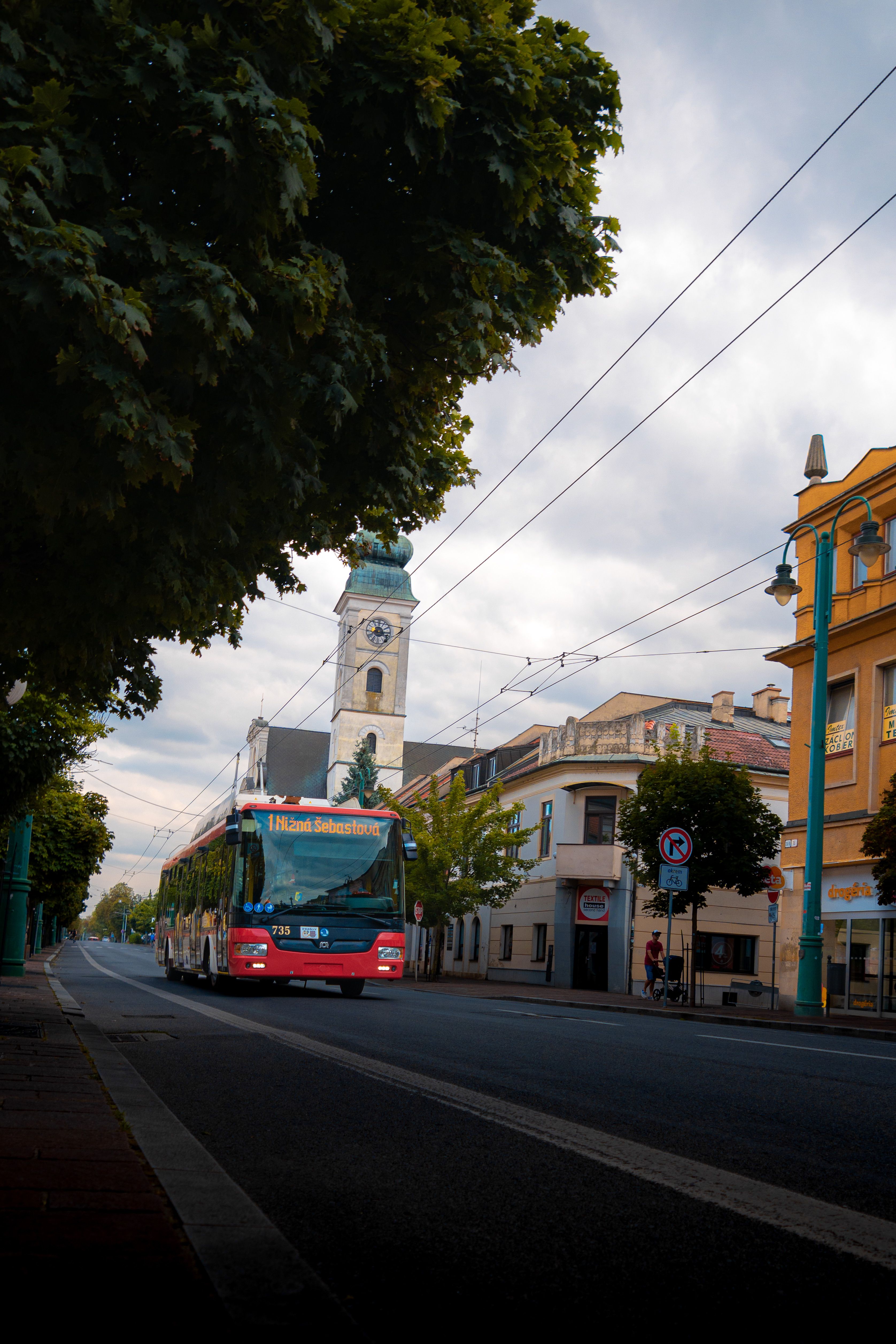 Scenic Street View with Red Bus and Clock Tower · Free Stock Photo