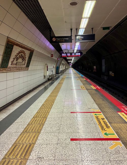 Free Deserted platform at Istanbul metro station with directional signs and architecture. Stock Photo