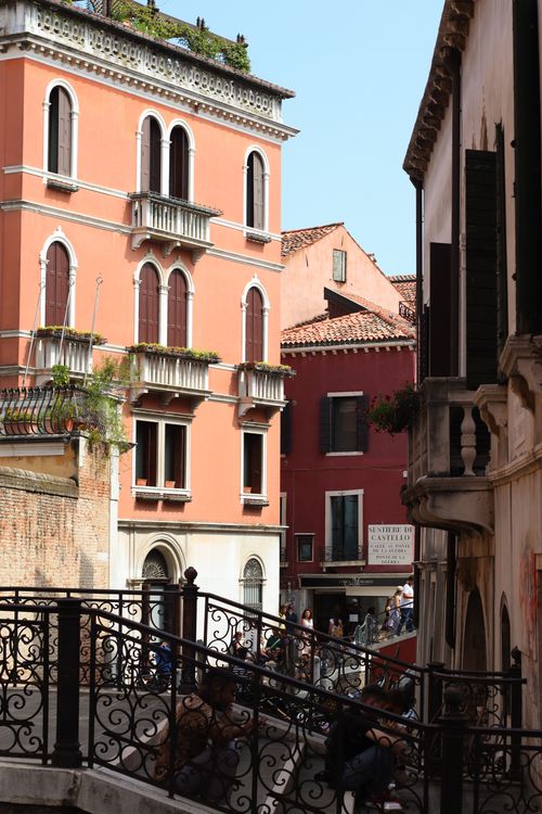 Free A picturesque view of Venetian architecture featuring a classic arch bridge under a sunny sky. Stock Photo