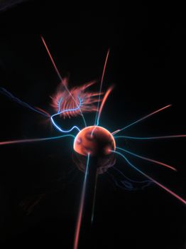 A mesmerizing view of a plasma ball emitting colorful electric discharges.