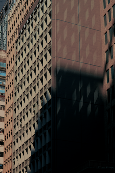 High-rise buildings with striking light and shadow patterns in Hong Kong.