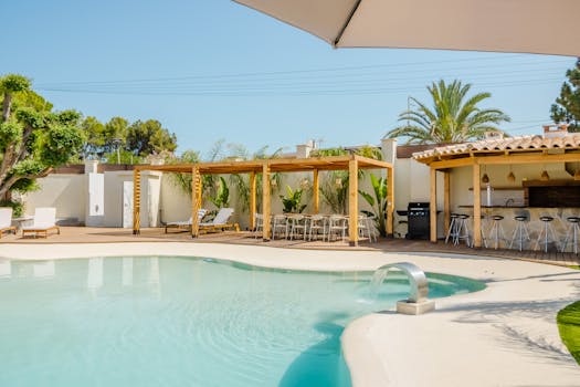 Modern villa with pool in Spain, featuring elegant architecture and outdoor dining area.