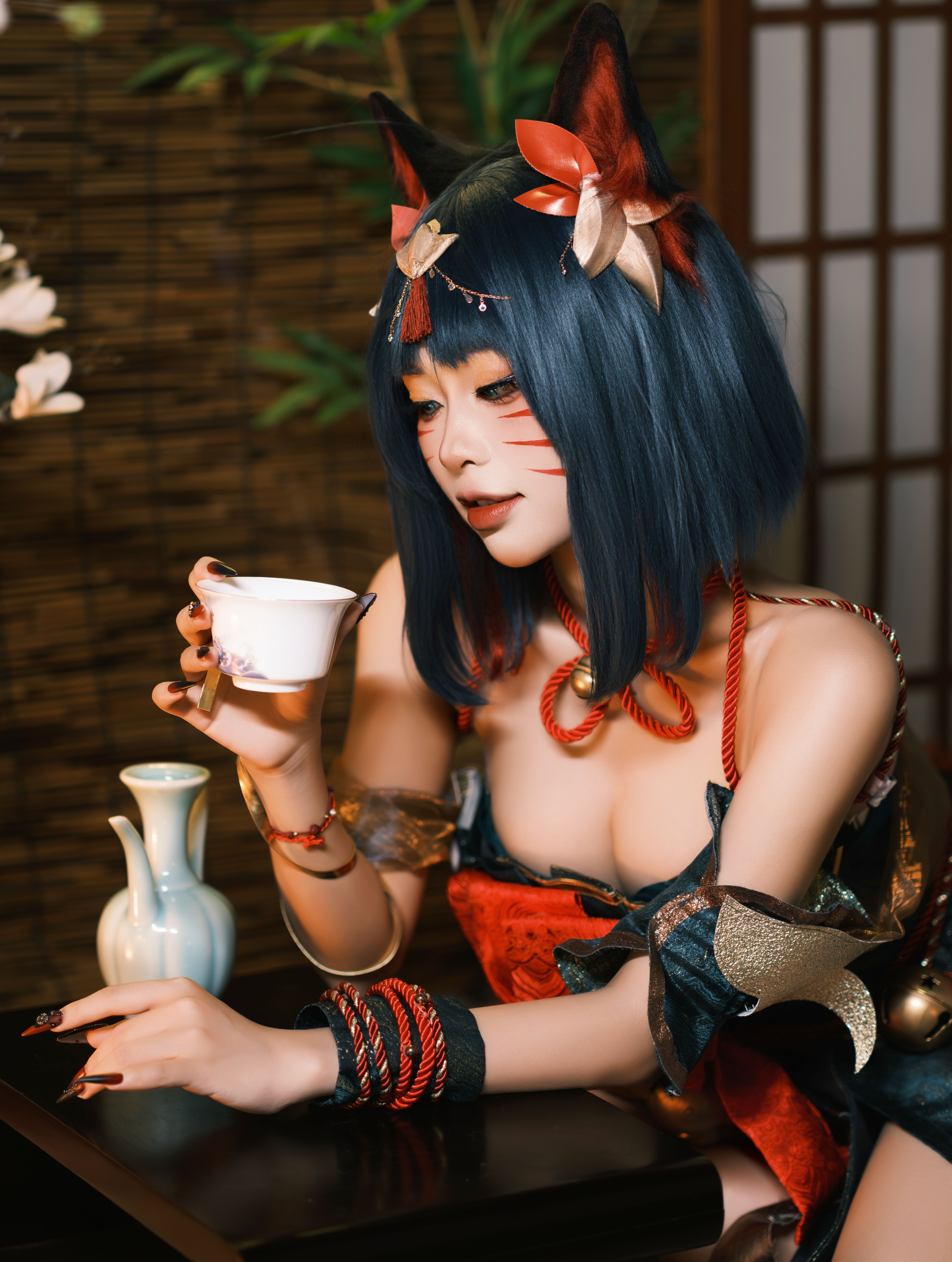 Elegant Woman in Japanese-Inspired Attire Enjoying Tea