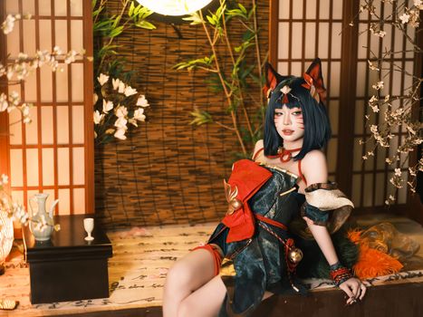 A captivating cosplay portrait in a traditional Japanese interior with shoji screens and cherry blossoms.