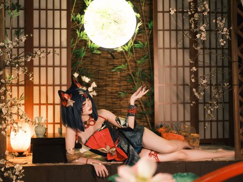 Free Beautiful cosplay portrait indoors with traditional Japanese decor and cherry blossoms. Stock Photo