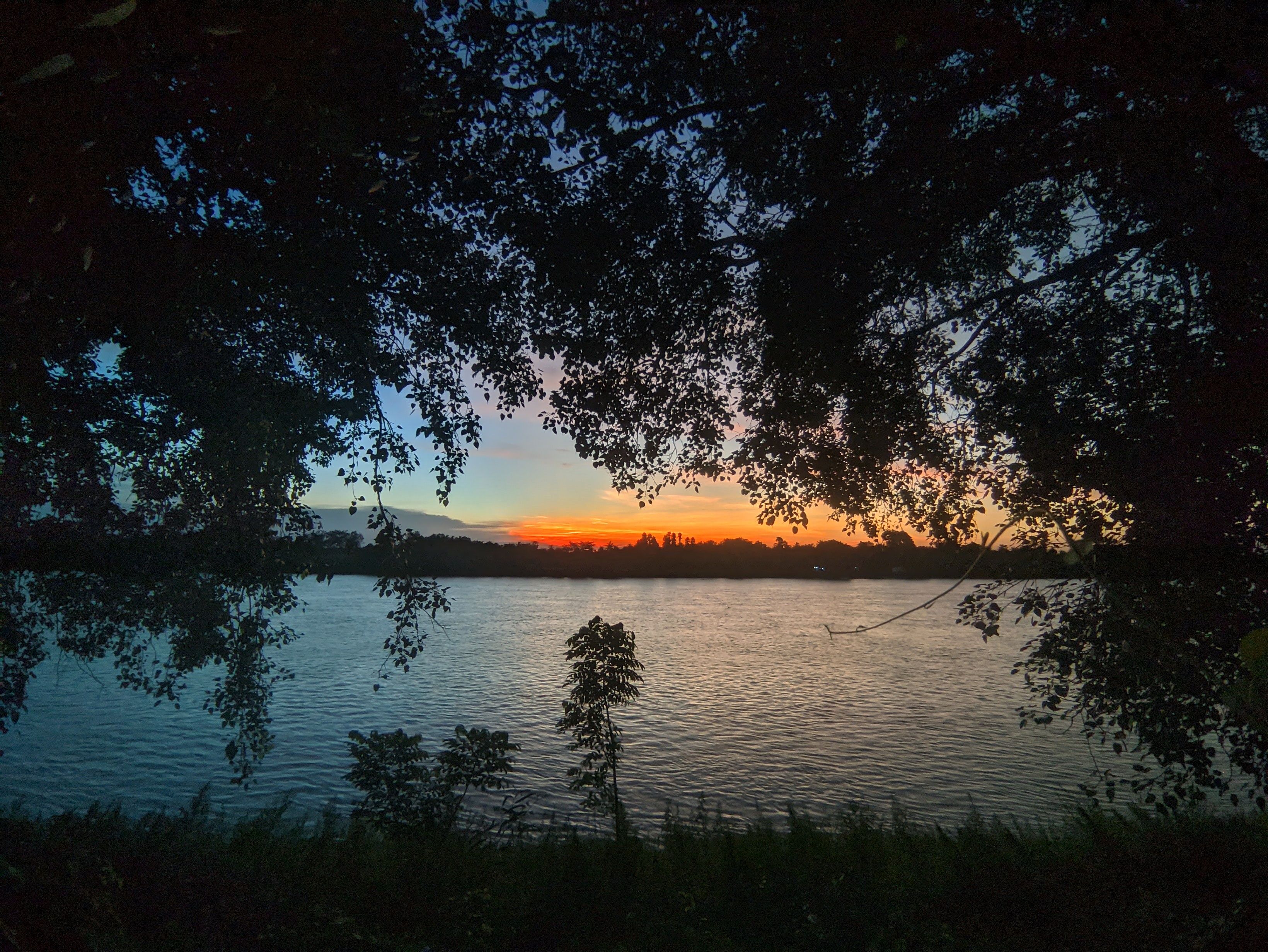 Scenic Sunset Over Tranquil River · Free Stock Photo