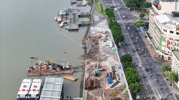Aerial shot of construction site and busy road along Ho Chi Minh City's waterfront.