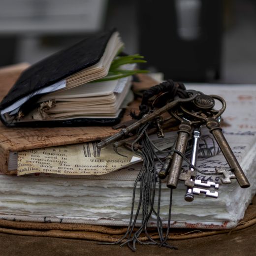 Vintage cloth-bound journals with antique keys — photo by Danyale R Zink on Pexels