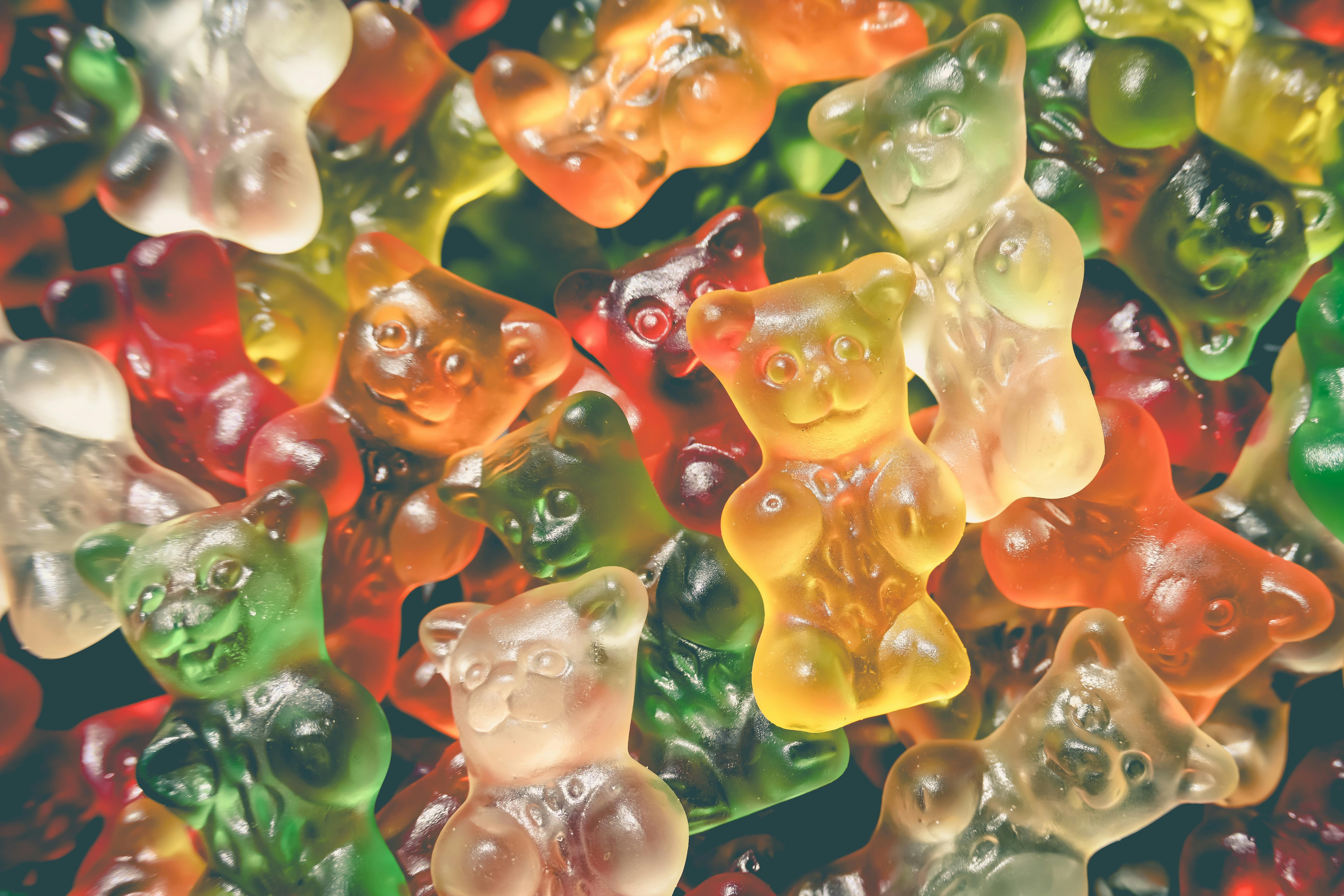 Vibrant and tasty gummy bears, a colorful assortment of sweet candy. Perfect for confectionery and dessert imagery.