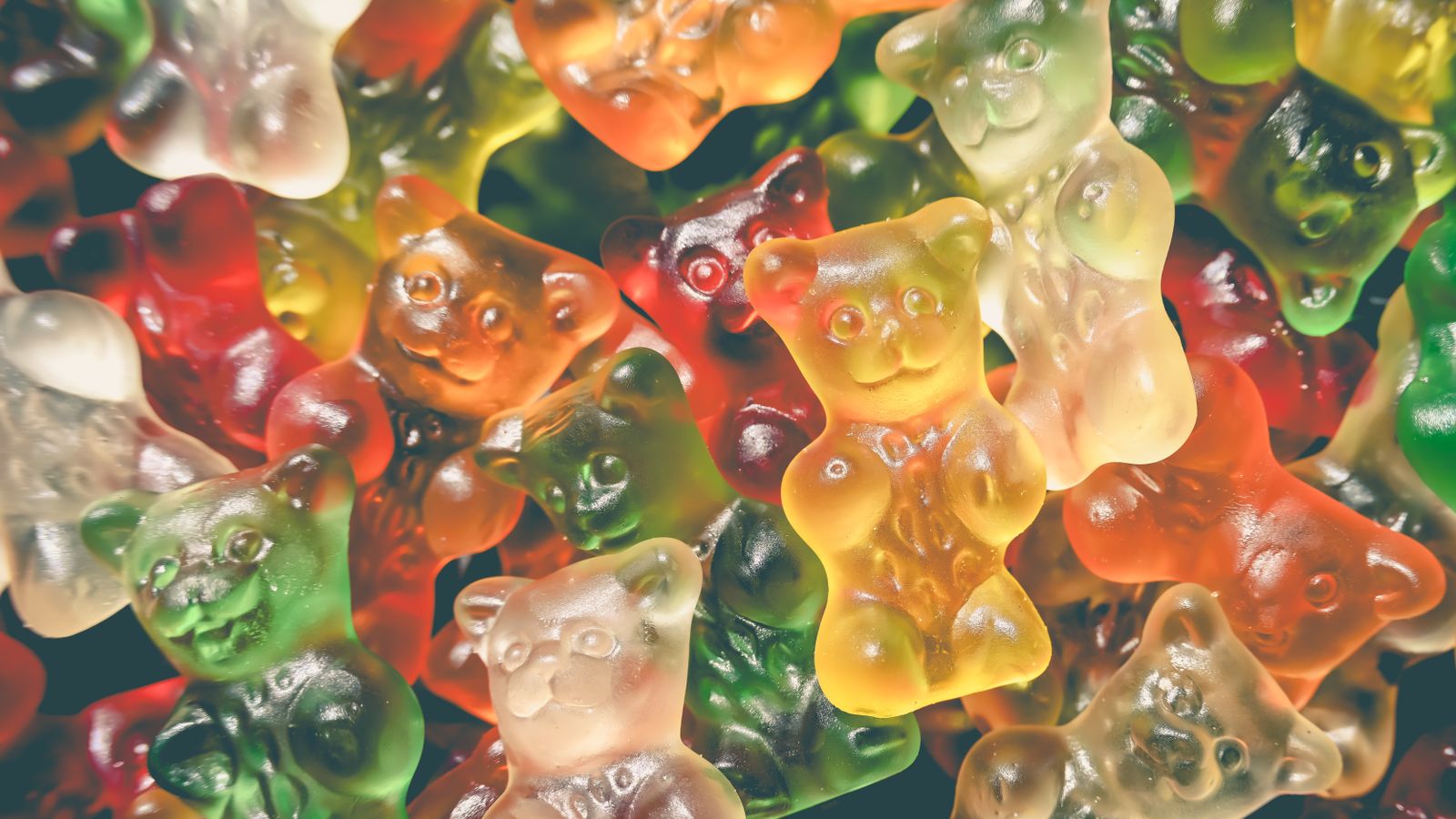 Vibrant and tasty gummy bears, a colorful assortment of sweet candy. Perfect for confectionery and dessert imagery.