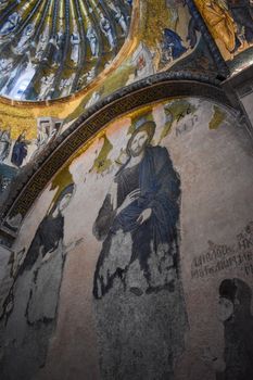 Intricate Byzantine mosaics depicting saints in a historic church interior.
