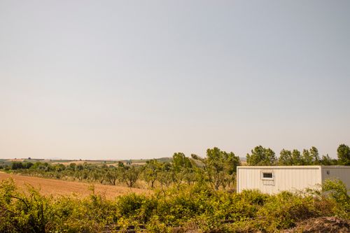Free Scenic rural view with a white container amid fields and trees in Bursa, Türkiye. Stock Photo
