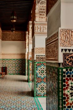 Beautiful mosaic and carved details in a Marrakech architectural masterpiece.