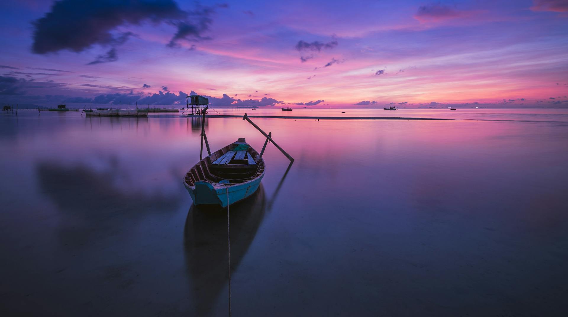 Green Boat With Oars on Both Side during Golden Hour Panoramic Photography