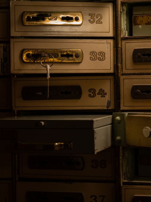 Free A collection of vintage lockers with keys, capturing a nostalgic and moody atmosphere. Stock Photo