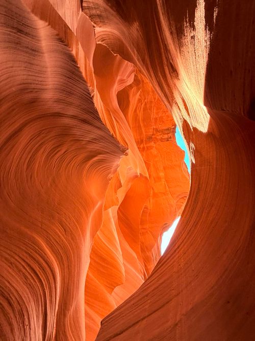 Free Stunning view of Antelope Canyon's vibrant red rock formations illuminated by sunlight. Stock Photo