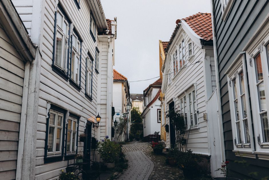 Rainy street in Bergen, Norway, with colorful houses and reflections