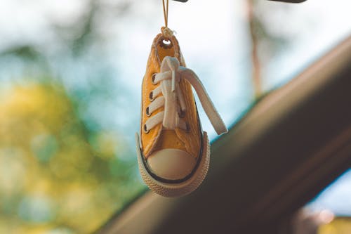 Free Yellow and White Low-top Sneaker Keychain Stock Photo