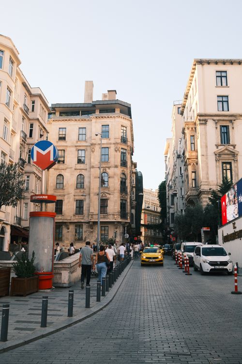 Free Bustling Istiklal Avenue in Istanbul with metro sign and vehicles. Stock Photo