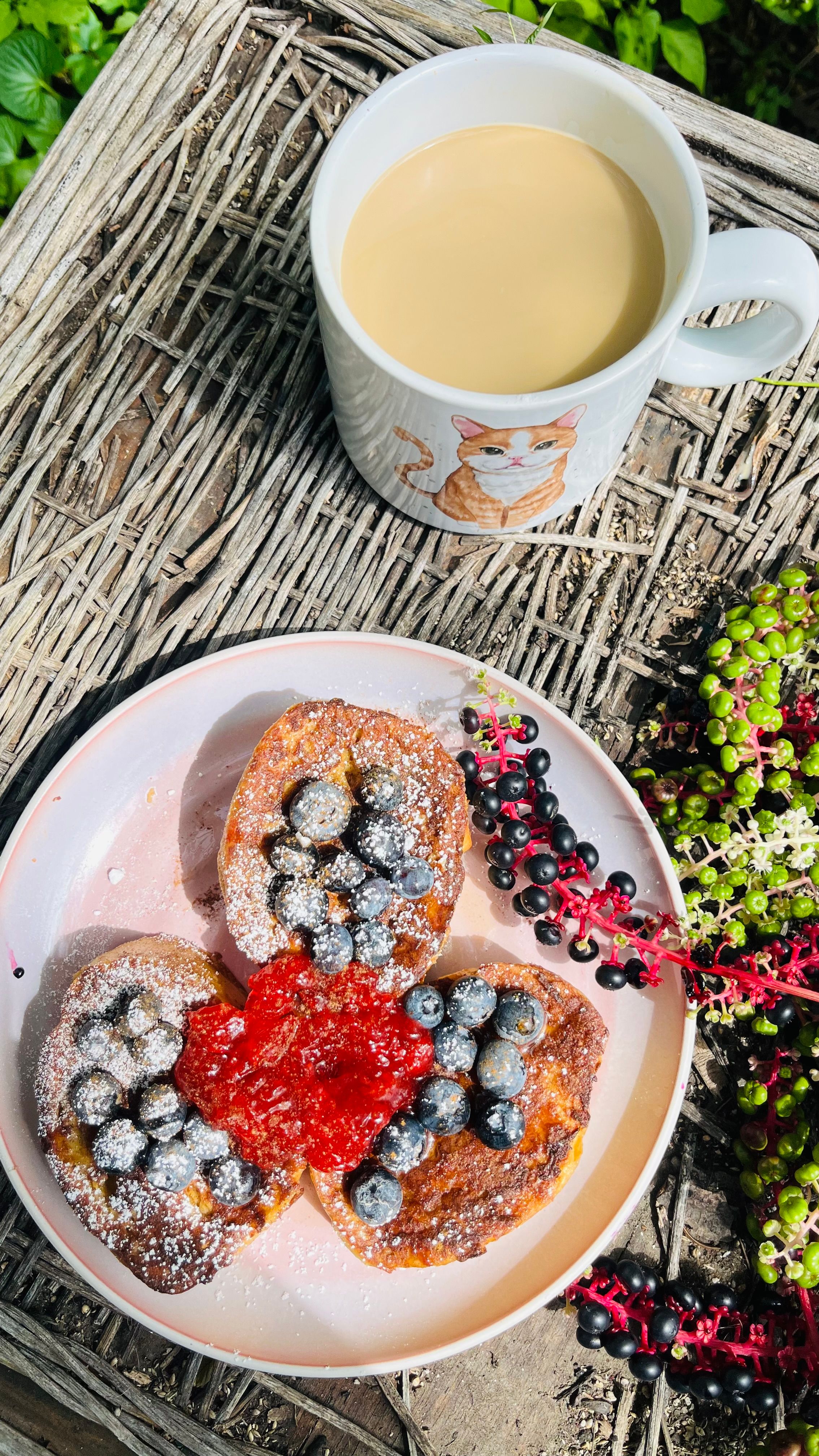 A mouthwatering French toast breakfast served with blueberries and coffee.