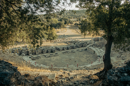 Free Explore the rustic beauty of ancient amphitheater ruins set in a lush, serene landscape. Stock Photo