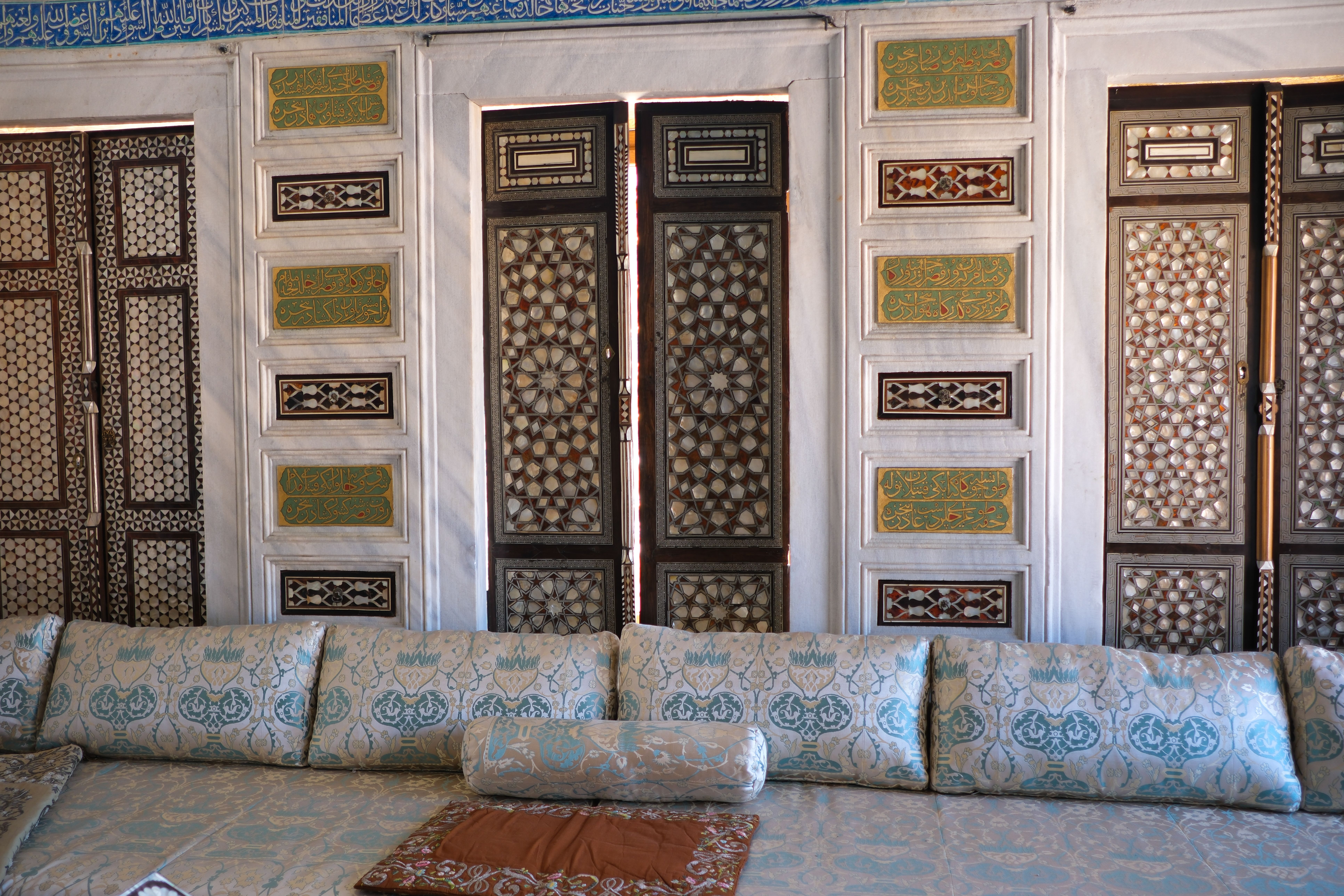 Detailed Ottoman-style interior with ornate woodwork and textiles in Istanbul, Turkey.