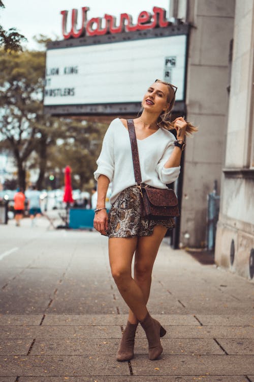 Shallow Focus Photo of Woman in White Sweater