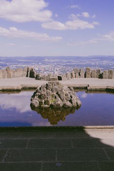 Scenic view over Kassel, Germany with historic architecture and tranquil water reflection.