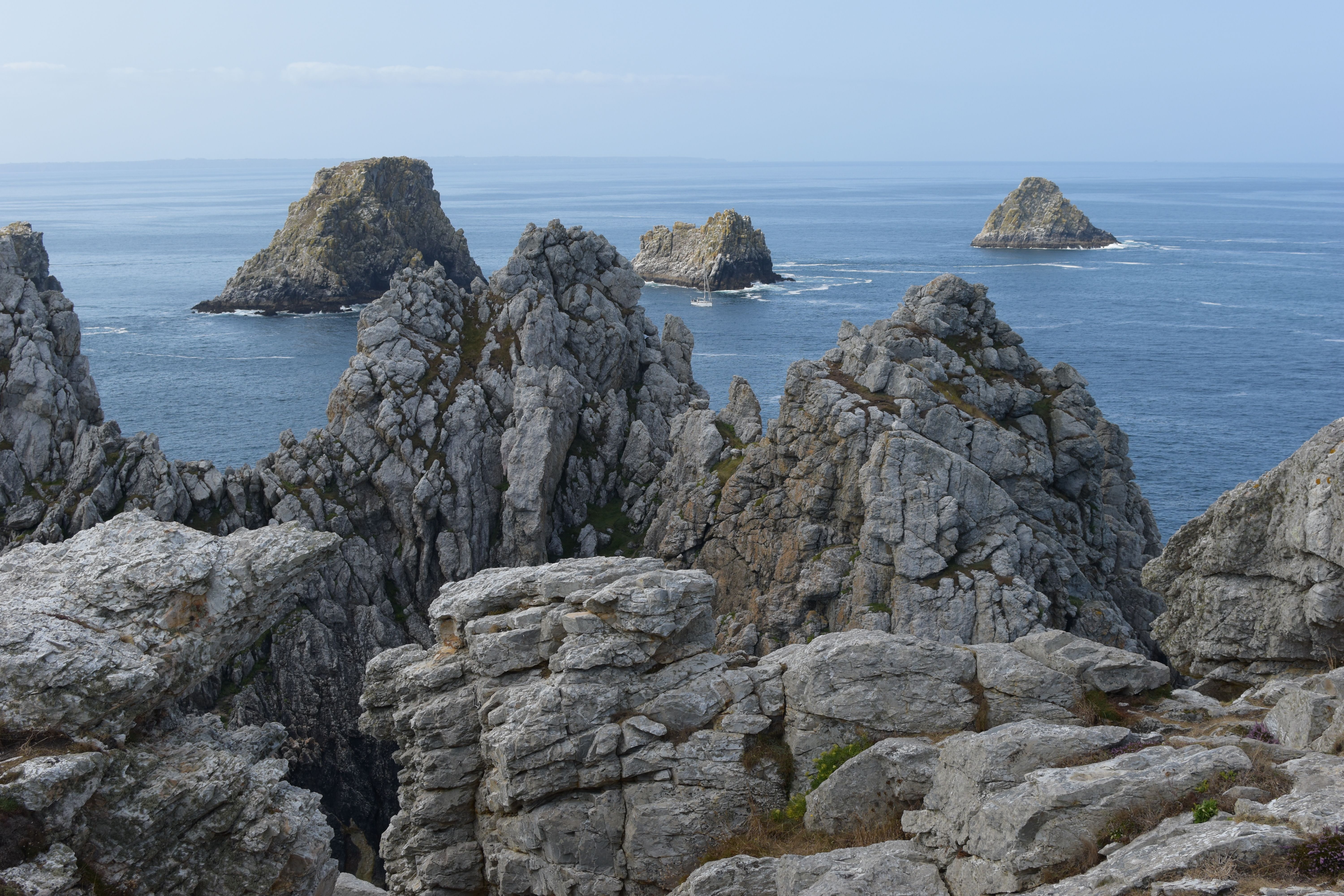 Majestic rock formations rise from the sea in Camaret-sur-Mer, France.