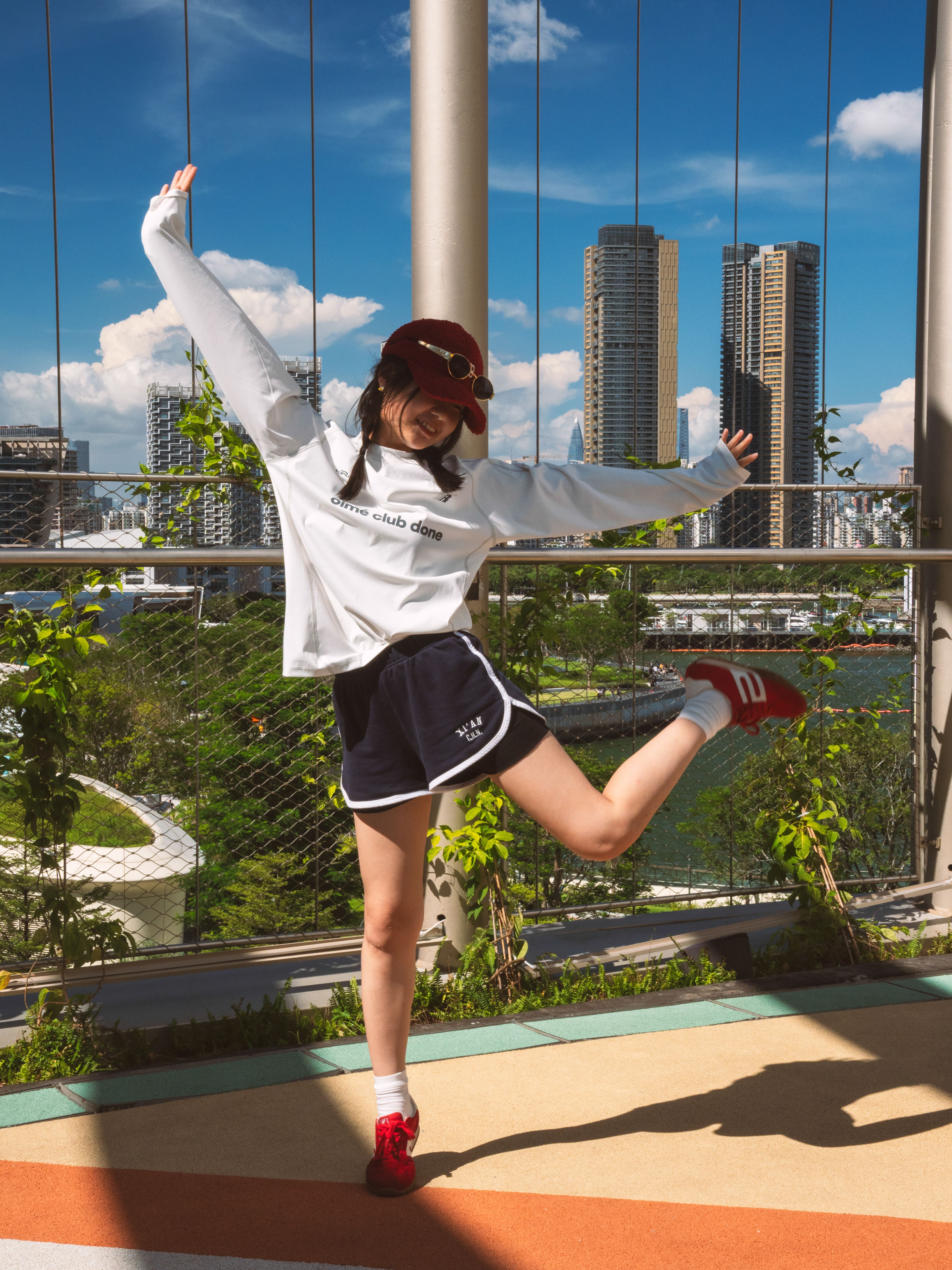 Joyful Young Woman Posing Outdoors in City · Free Stock Photo