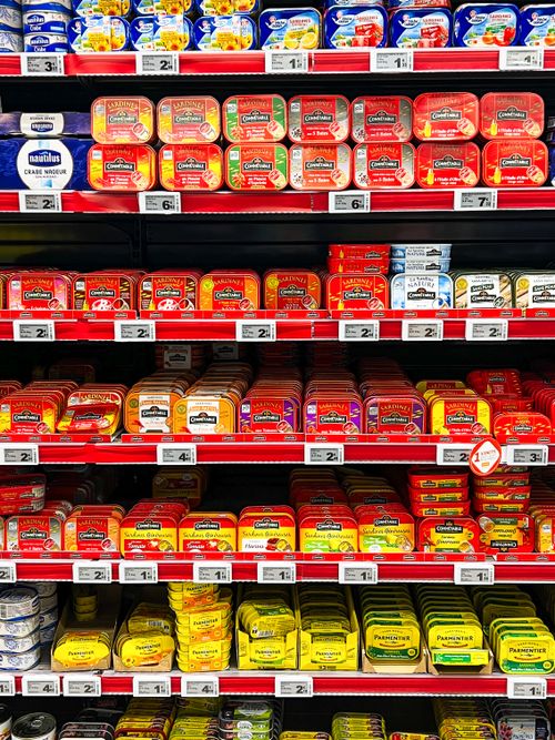 Free A vibrant assortment of canned fish in a French supermarket aisle. Stock Photo