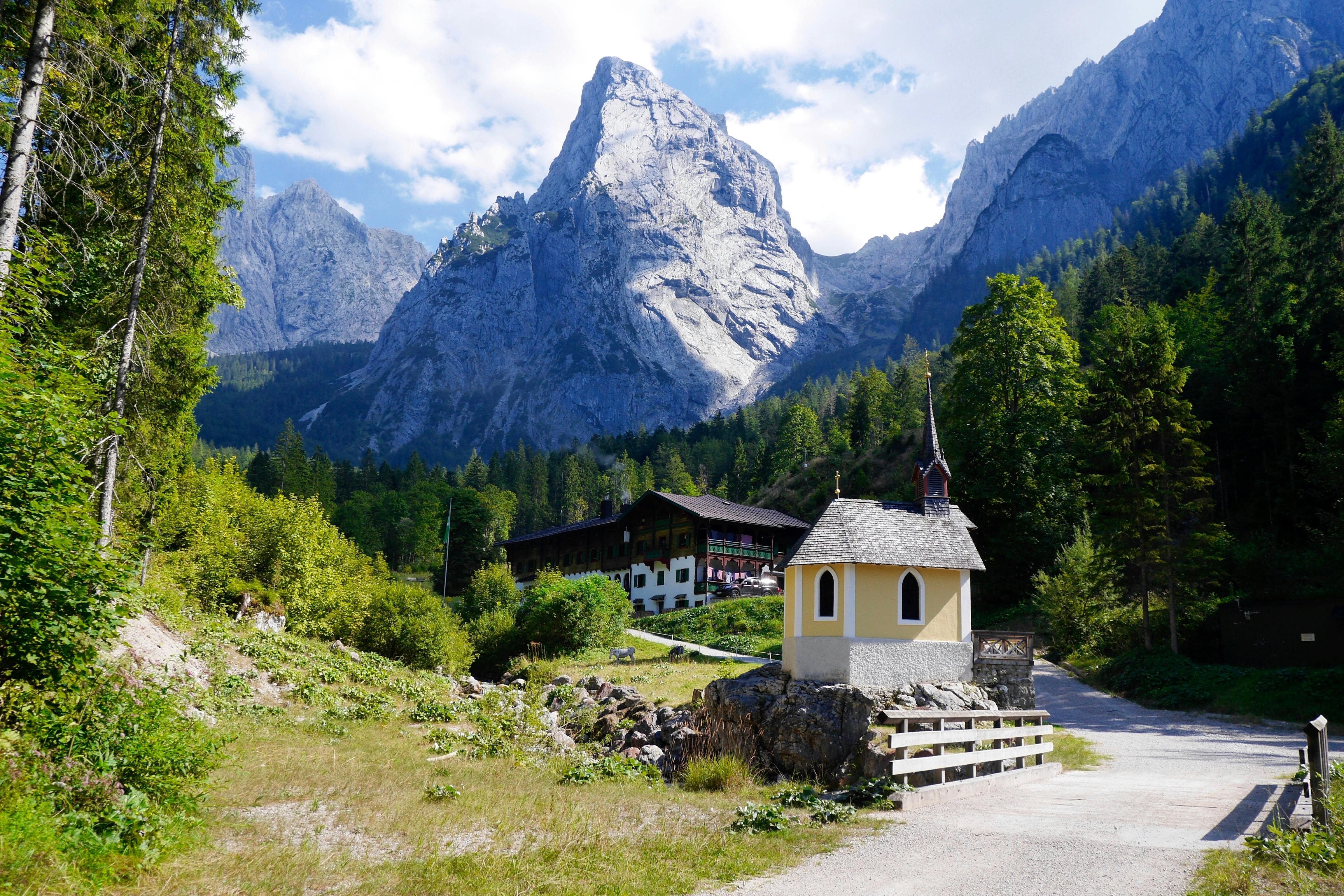 View Of Village With Mountain Range In Background Free Stock Photo